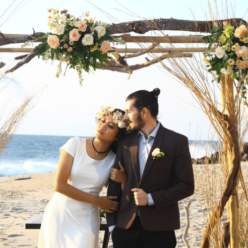 Newly Married Filipino Woman and American Man at Their Beach Wedding