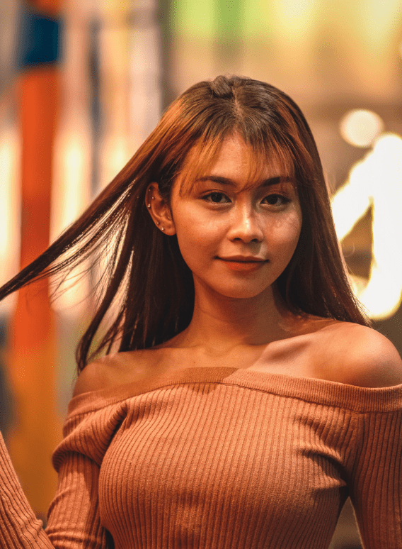 Sexy Filipina Date Twirling Her Hair While Out on a Date at Night